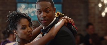 Movie still from “Footloose” (2011), directed by Craig Brewer – A man and a woman in formal wear posing for a picture; Close Up shot, Over the shoulder angle