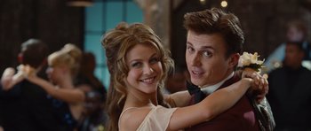 Movie still from “Footloose” (2011), directed by Craig Brewer – A man and a woman posing for a picture; Close Up shot, Low angle
