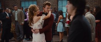Movie still from “Footloose” (2011), directed by Craig Brewer – A man and a woman dancing in front of a crowd; Medium shot, Over the shoulder angle