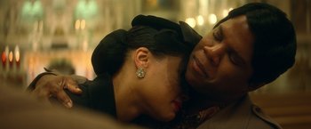 Movie still from “The United States vs. Billie Holiday” (2021), directed by Lee Daniels – A person laying on a woman's chest; Close Up shot, Over the shoulder angle