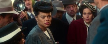 Movie still from “The United States vs. Billie Holiday” (2021), directed by Lee Daniels – An image of a woman in a crowd of people; Close Up shot, Over the shoulder angle