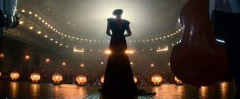 Movie still from “The United States vs. Billie Holiday” (2021), directed by Lee Daniels – A woman standing on a stage in front of an audience; Wide shot, Low angle