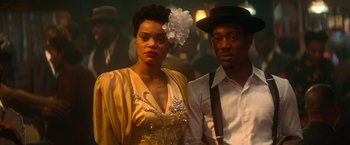 Movie still from “The United States vs. Billie Holiday” (2021), directed by Lee Daniels – A man and a woman standing next to each other; Close Up shot, Over the shoulder angle