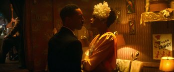 Movie still from “The United States vs. Billie Holiday” (2021), directed by Lee Daniels – A man and a woman are kissing in a room; Close Up shot, Low angle