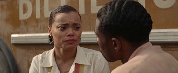 Movie still from “The United States vs. Billie Holiday” (2021), directed by Lee Daniels – A woman and a man are talking to each other; Close Up shot, Over the shoulder angle