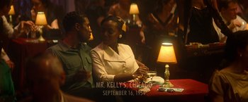 Movie still from “The United States vs. Billie Holiday” (2021), directed by Lee Daniels – A man and a woman sitting at a dinner table; Medium shot, Over the shoulder angle
