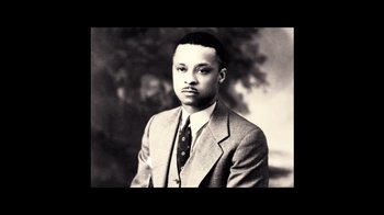 Movie still from “The United States vs. Billie Holiday” (2021), directed by Lee Daniels – An old black and white photo of a man in a suit; Close Up shot, High angle