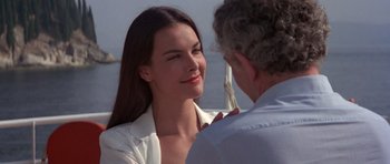 Movie still from “For Your Eyes Only” (1981), directed by John Glen – A man and a woman are talking to each other; Close Up shot, Over the shoulder angle