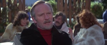 Movie still from “For Your Eyes Only” (1981), directed by John Glen – An older man with a beard and a mustache; Close Up shot, Low angle