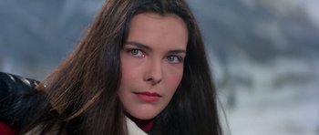 Movie still from “For Your Eyes Only” (1981), directed by John Glen – A person with long black hair; Close Up shot, High angle