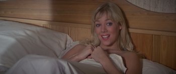 Movie still from “For Your Eyes Only” (1981), directed by John Glen – A beautiful young lady laying in a bed; Close Up shot, High angle