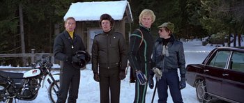 Movie still from “For Your Eyes Only” (1981), directed by John Glen – A group of people standing in the snow; Medium shot, Low angle