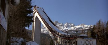Movie still from “For Your Eyes Only” (1981), directed by John Glen – A ski slope that has a ski lift going up it; Extreme Wide shot, Low angle