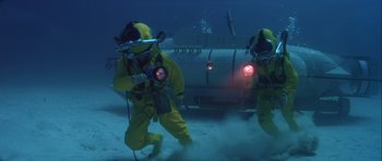 Movie still from “For Your Eyes Only” (1981), directed by John Glen – A couple of people that are in the water; Wide shot, Low angle
