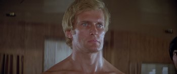 Movie still from “For Your Eyes Only” (1981), directed by John Glen – A person wearing a shirt and looking to his left; Close Up shot, Low angle