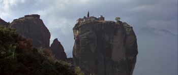 Movie still from “For Your Eyes Only” (1981), directed by John Glen – A view of a small town on top of a mountain; Extreme Wide shot, Low angle