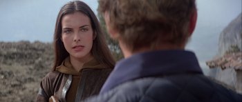 Movie still from “For Your Eyes Only” (1981), directed by John Glen – A young woman standing in front of a young man; Close Up shot, Over the shoulder angle