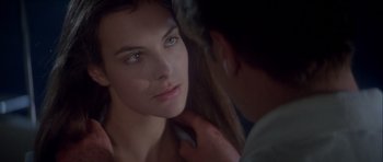 Movie still from “For Your Eyes Only” (1981), directed by John Glen – A woman's face with a man touching her hair; Close Up shot, Over the shoulder angle