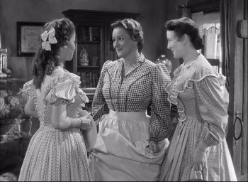 Movie still from “Fort Apache” (1948), directed by John Ford – A group of women standing next to each other in a room; Medium shot, Low angle