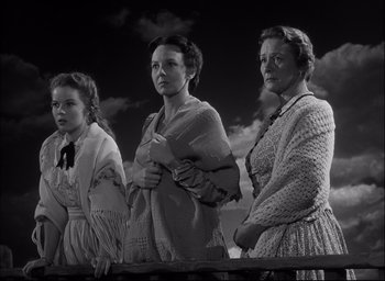 Movie still from “Fort Apache” (1948), directed by John Ford – A group of women standing next to each other; Medium shot, Low angle