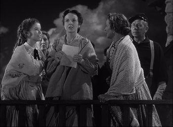 Movie still from “Fort Apache” (1948), directed by John Ford – A black and white photo of a group of people; Medium shot, Low angle