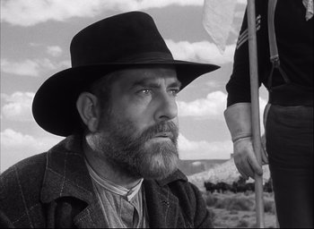 Movie still from “Fort Apache” (1948), directed by John Ford – A man with a long beard wearing a black hat; Close Up shot, Low angle