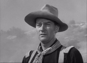 Movie still from “Fort Apache” (1948), directed by John Ford – A man wearing a cowboy hat and a bandana; Close Up shot, Low angle