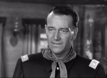 Movie still from “Fort Apache” (1948), directed by John Ford – A black and white photo of a man wearing a neck tie; Close Up shot, Low angle