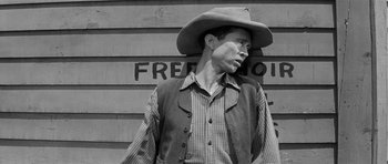 Movie still from “Forty Guns” (1957), directed by Samuel Fuller – A black and white photo of a man wearing a cowboy hat; Close Up shot, Low angle
