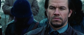 Movie still from “Four Brothers” (2005), directed by John Singleton – A person wearing a leather jacket; Close Up shot, Over the shoulder angle