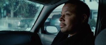 Movie still from “Four Brothers” (2005), directed by John Singleton – A man sitting in the driver's seat of a car; Close Up shot, Over the shoulder angle