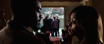Movie still from “Four Brothers” (2005), directed by John Singleton – A man and a woman talking to each other; Close Up shot, Over the shoulder angle