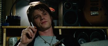 Movie still from “Four Brothers” (2005), directed by John Singleton – A man holding a cell phone up to his ear; Close Up shot, Low angle