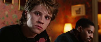 Movie still from “Four Brothers” (2005), directed by John Singleton – A person with a person looking at the camera; Close Up shot, Over the shoulder angle