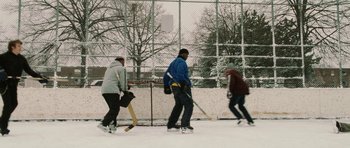 Movie still from “Four Brothers” (2005), directed by John Singleton – A group of people playing a game of ice hockey; Wide shot, High angle