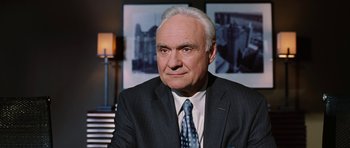 Movie still from “Four Brothers” (2005), directed by John Singleton – An older man wearing a suit and tie; Close Up shot, Over the shoulder angle