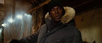 Movie still from “Four Brothers” (2005), directed by John Singleton – A man wearing a black parka and a black hat; Close Up shot, Low angle