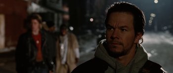 Movie still from “Four Brothers” (2005), directed by John Singleton – A person wearing a hooded jacket; Close Up shot, Over the shoulder angle