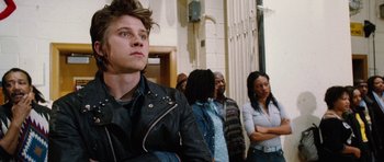 Movie still from “Four Brothers” (2005), directed by John Singleton – A group of people standing in front of a building; Close Up shot, Low angle