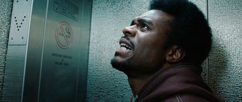 Movie still from “Four Brothers” (2005), directed by John Singleton – A person looking up; Close Up shot, Overhead angle