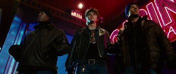 Movie still from “Four Brothers” (2005), directed by John Singleton – A group of young men standing next to each other in a room; Medium shot, Low angle