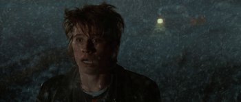 Movie still from “Four Brothers” (2005), directed by John Singleton – A man in a black jacket standing in the rain; Close Up shot, Over the shoulder angle
