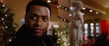 Movie still from “Four Brothers” (2005), directed by John Singleton – A person wearing a black shirt; Close Up shot, Over the shoulder angle