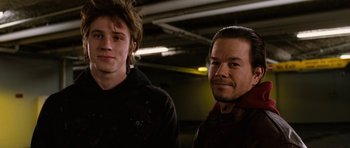 Movie still from “Four Brothers” (2005), directed by John Singleton – Two young men standing next to each other in a building; Close Up shot, Low angle