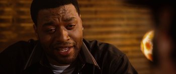 Movie still from “Four Brothers” (2005), directed by John Singleton – A person wearing a black jacket; Close Up shot, Over the shoulder angle