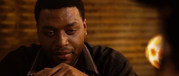 Movie still from “Four Brothers” (2005), directed by John Singleton – A person wearing a black shirt; Close Up shot, Over the shoulder angle