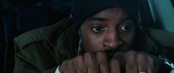 Movie still from “Four Brothers” (2005), directed by John Singleton – A person with his hand on his face; Close Up shot, Overhead angle