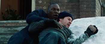 Movie still from “Four Brothers” (2005), directed by John Singleton – Two men are fighting in the snow outside; Close Up shot, Overhead angle