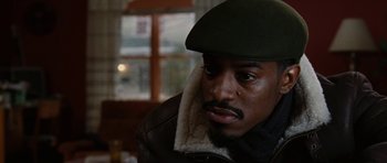 Movie still from “Four Brothers” (2005), directed by John Singleton – A person wearing a hat and jacket; Close Up shot, Low angle