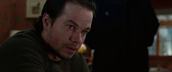 Movie still from “Four Brothers” (2005), directed by John Singleton – A person with his eyes closed; Close Up shot, Over the shoulder angle